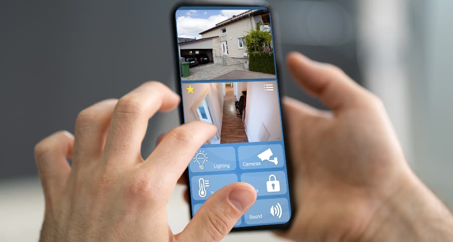 Person checking video camera feeds on a smartphone
